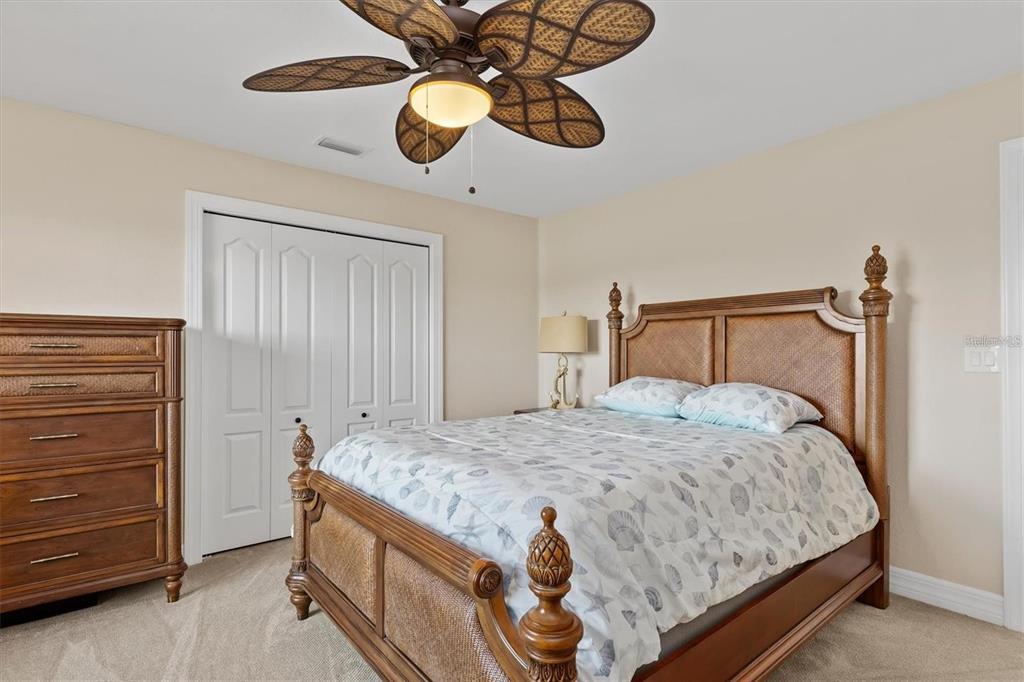 1701 Casey Key Drive Punta Gorda, FL 33950 - Photo 27 of 58 a bedroom with a bed and a chandelier