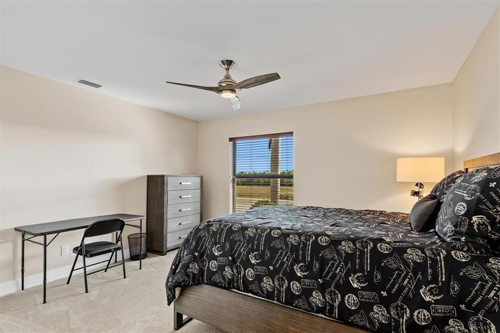 1701 Casey Key Drive Punta Gorda, FL 33950 - Photo 30 of 58 a bedroom with a bed and a table in it