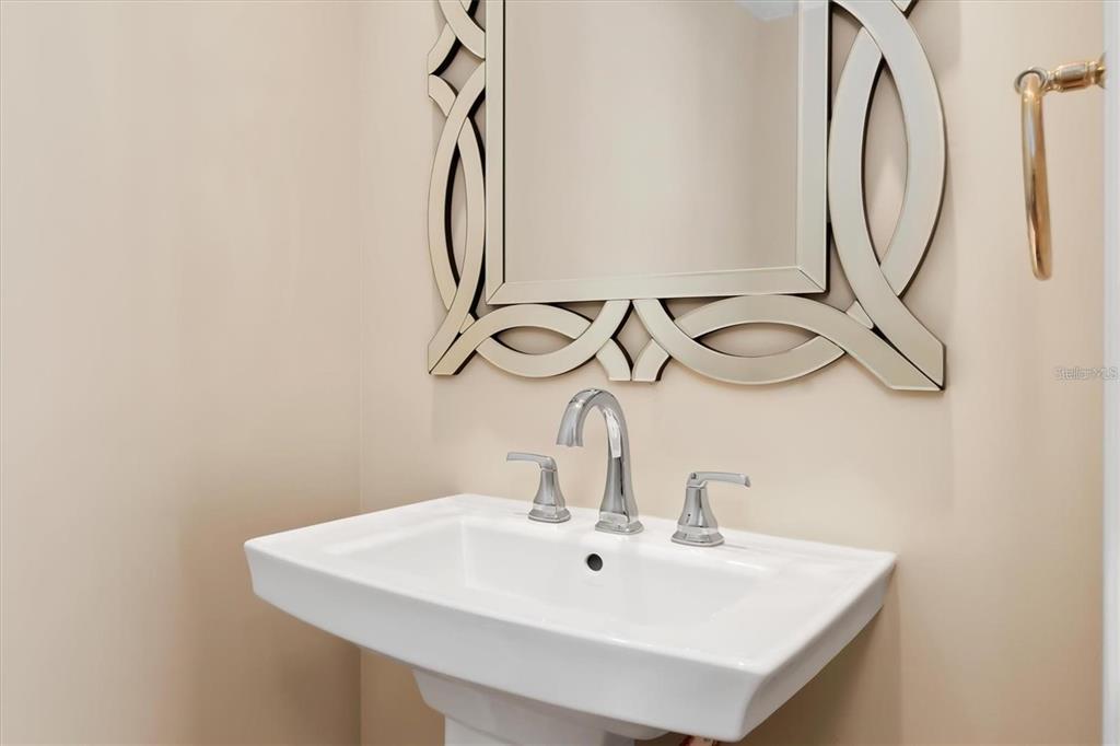 1701 Casey Key Drive Punta Gorda, FL 33950 - Photo 38 of 58 a bathroom with a sink and a mirror