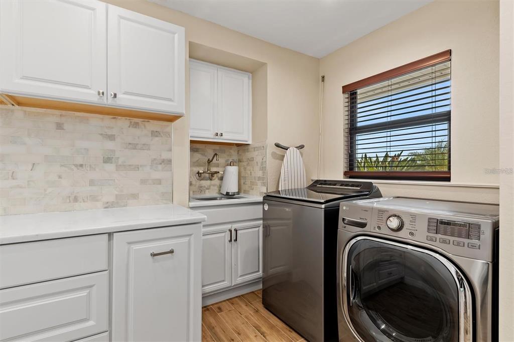 1701 Casey Key Drive Punta Gorda, FL 33950 - Photo 39 of 58 a view of a kitchen with sink dryer and washer