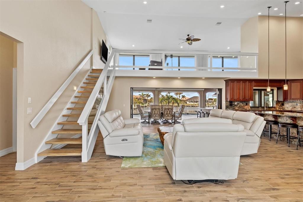 1701 Casey Key Drive Punta Gorda, FL 33950 - Photo 5 of 58 a living room with furniture and wooden floor