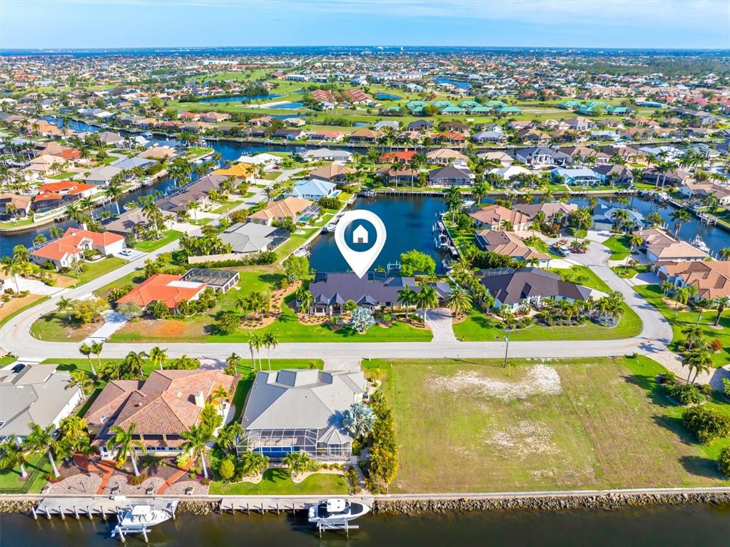 1701 Casey Key Drive Punta Gorda, FL 33950 - Photo 56 of 58 an aerial view of residential building and lake