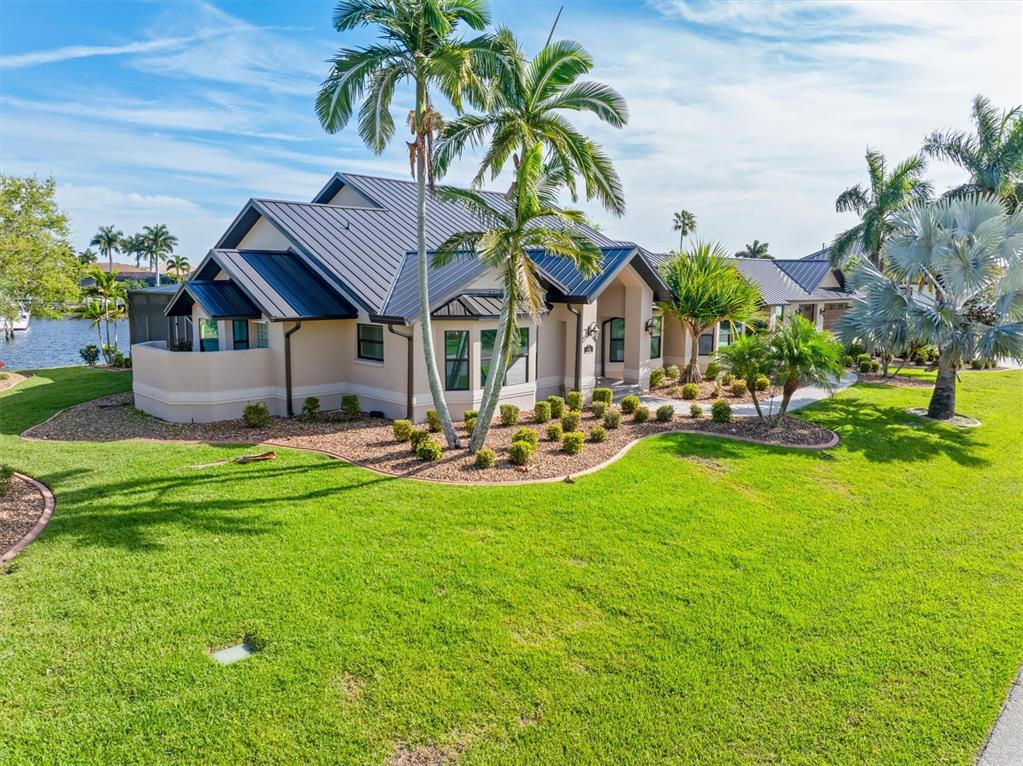 1701 Casey Key Drive Punta Gorda, FL 33950 - Photo 57 of 58 a front view of house with yard and outdoor seating