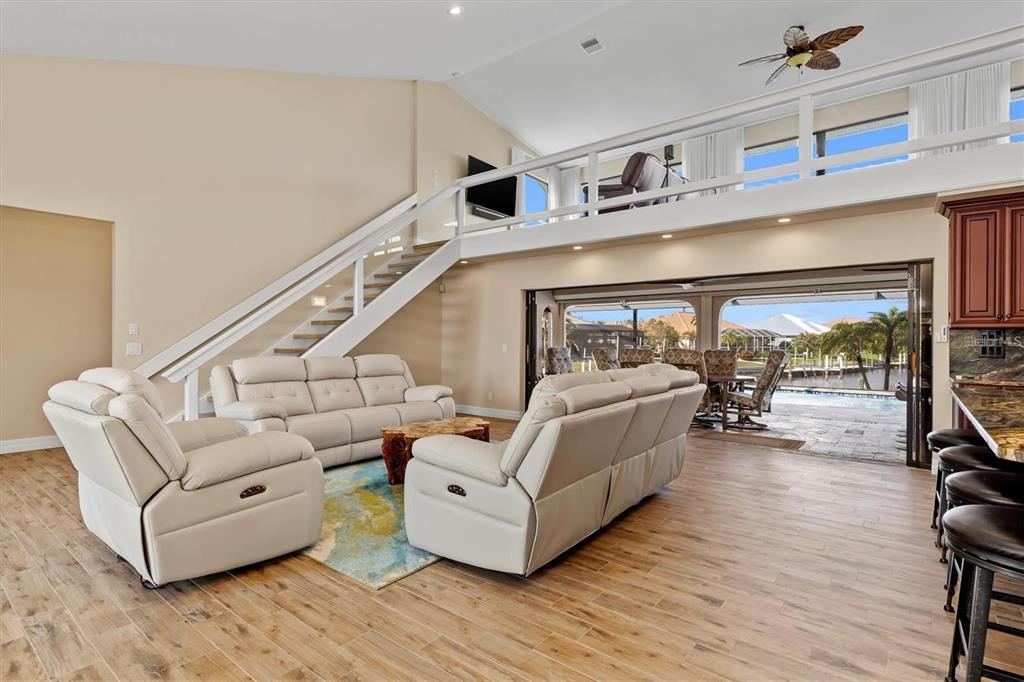 1701 Casey Key Drive Punta Gorda, FL 33950 - Photo 6 of 58 a living room with furniture and a large window