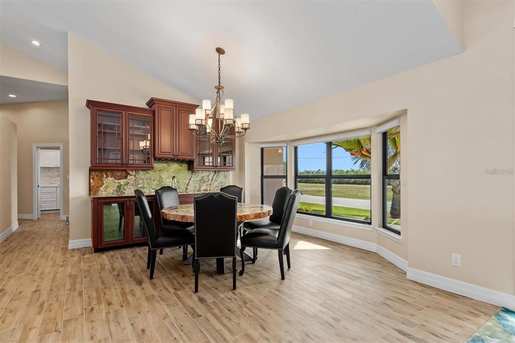 1701 Casey Key Drive Punta Gorda, FL 33950 - Photo 8 of 58 a view of a dining room with furniture window and wooden floor
