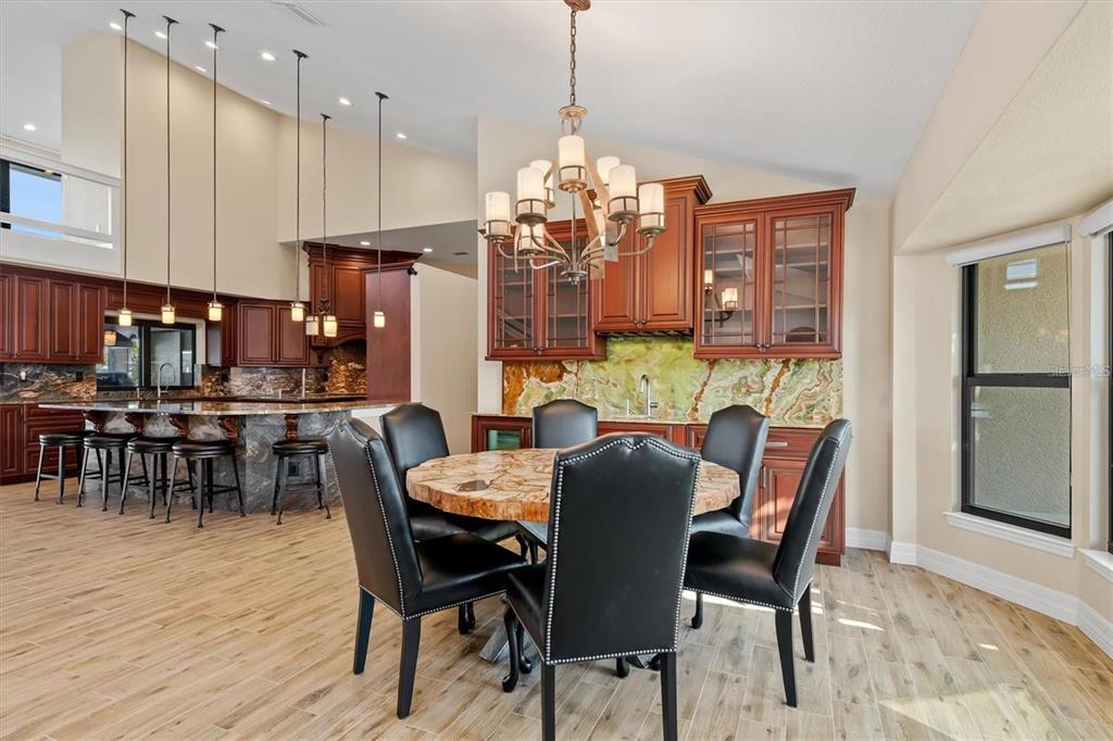 1701 Casey Key Drive Punta Gorda, FL 33950 - Photo 9 of 58 a view of a dining room with furniture and chandelier