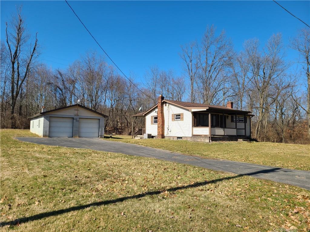 122 Logan Road New Castle, PA 16102 - Photo 1 of 17 a front view of a house with a yard