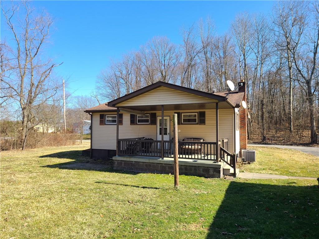 122 Logan Road New Castle, PA 16102 - Photo 2 of 17 a front view of a house with a yard