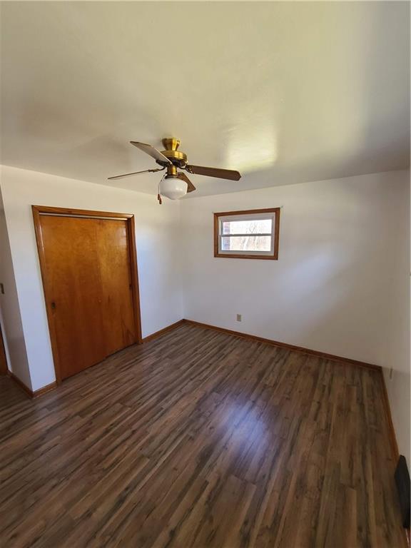 122 Logan Road New Castle, PA 16102 - Photo 8 of 17 a view of a room with wooden floors and ceiling fan