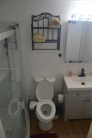 a bathroom with a toilet and a sink