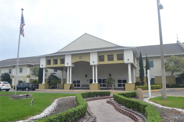 a front view of a house with a yard table and chairs
