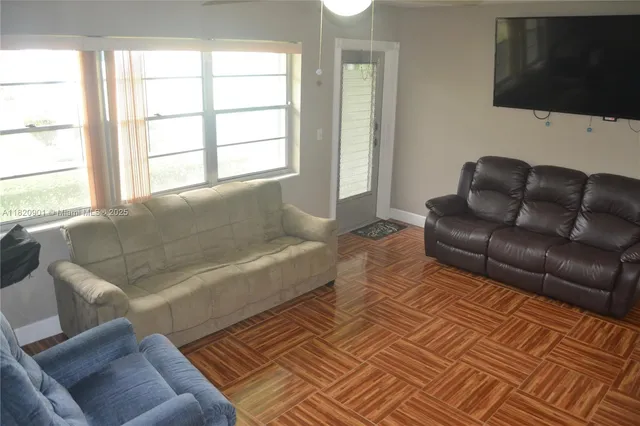 a living room with a couch and a flat screen tv