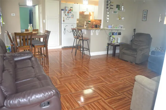 a living room with furniture and a table