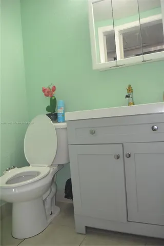 a bathroom with a toilet and a sink