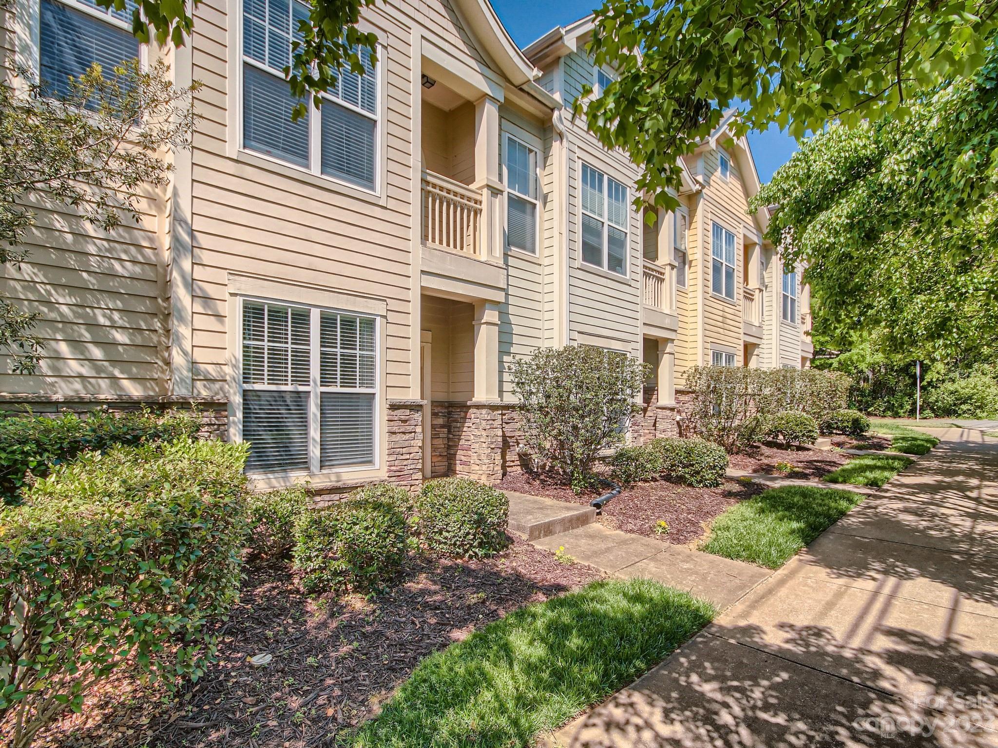 4130 Walker Road Charlotte, NC 28211 - Photo 3 of 28 a view of a house with a yard and potted plants