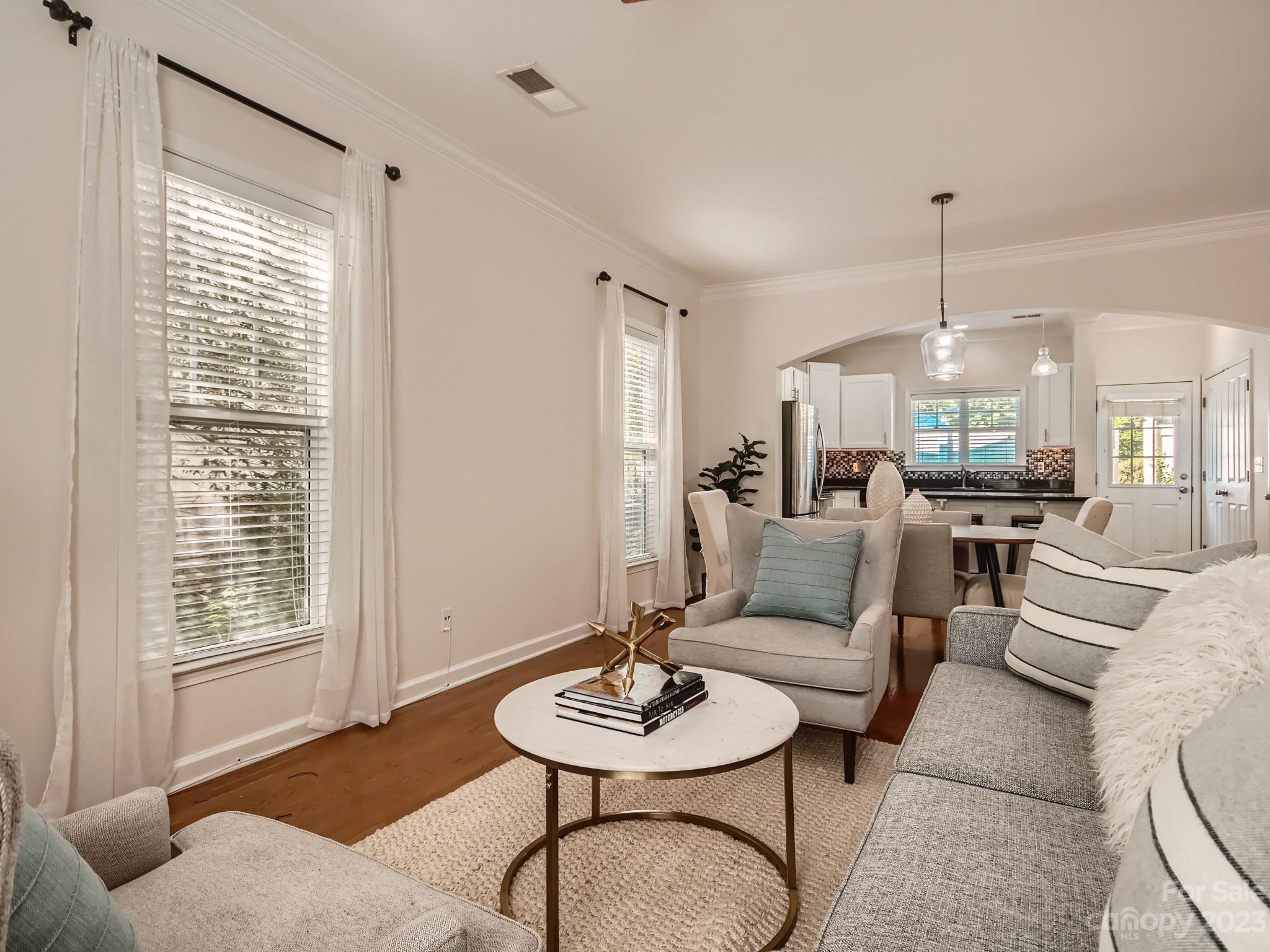 4130 Walker Road Charlotte, NC 28211 - Photo 7 of 28 a living room with furniture a dining table and a window
