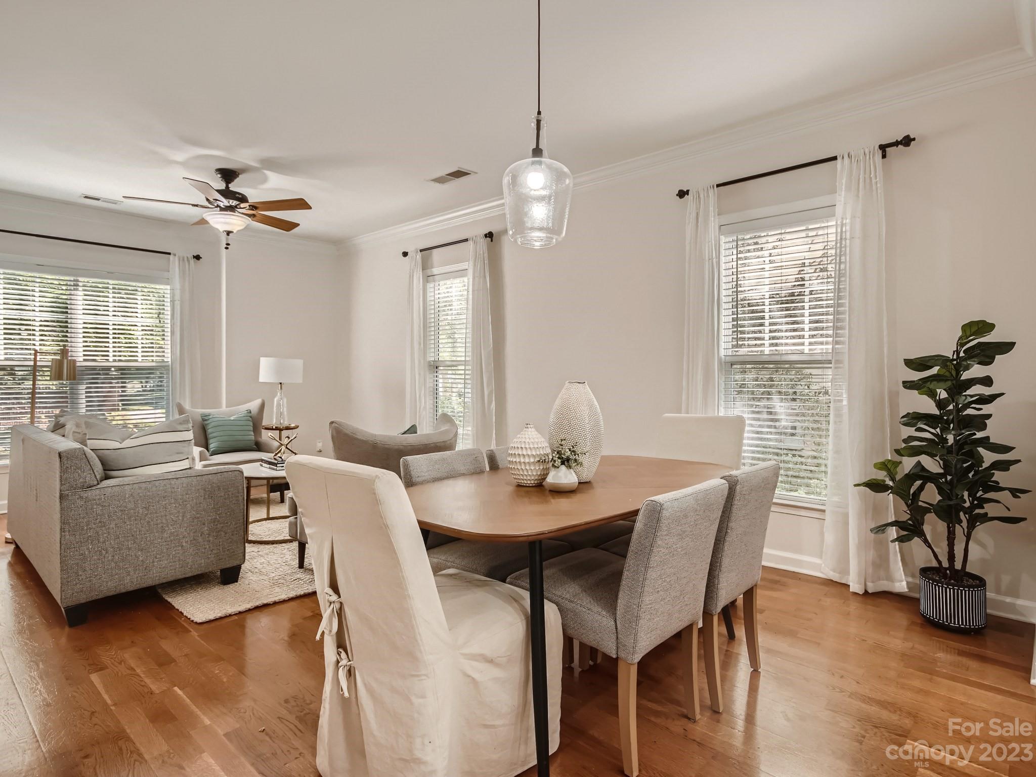 4130 Walker Road Charlotte, NC 28211 - Photo 8 of 28 a view of a dining room with furniture window and wooden floor