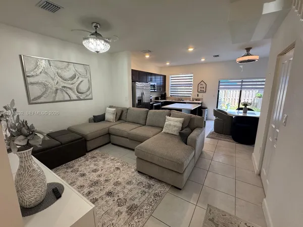 a living room with furniture and a couch