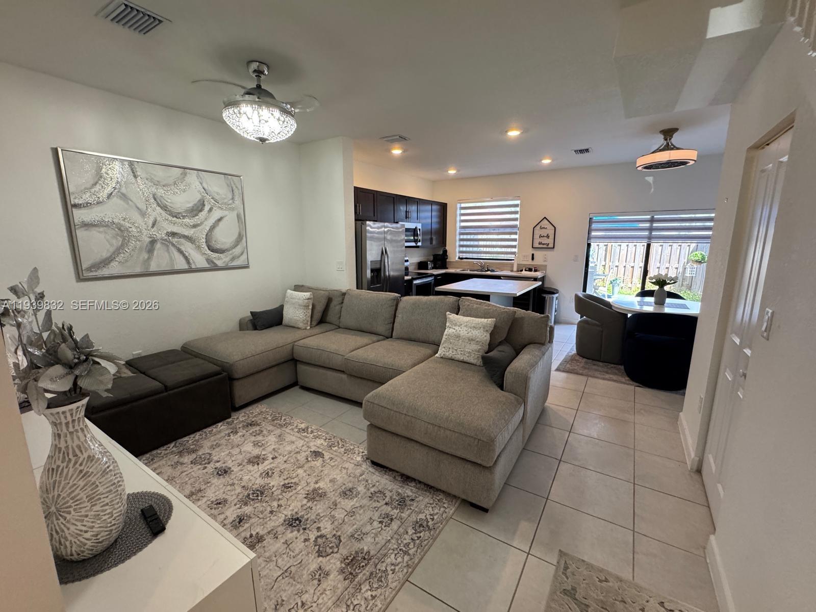 18236 Southwest 148th Road Miami, FL 33187 - Photo 9 of 9 a living room with furniture and a couch