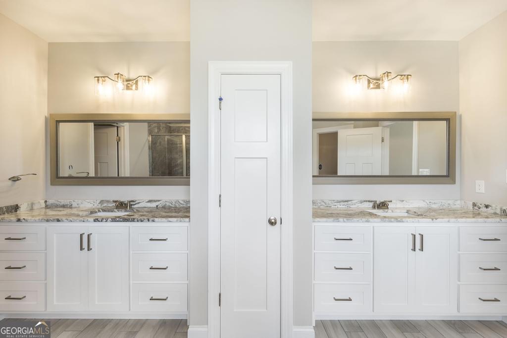 3563 Housers Mill Road Byron, GA 31008 - Photo 9 of 10 a bathroom with a sink vanity and mirror