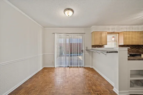 a view of a kitchen with a sink cabinets and a window