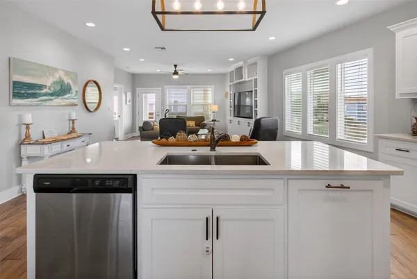 a kitchen with granite countertop a stove and a refrigerator
