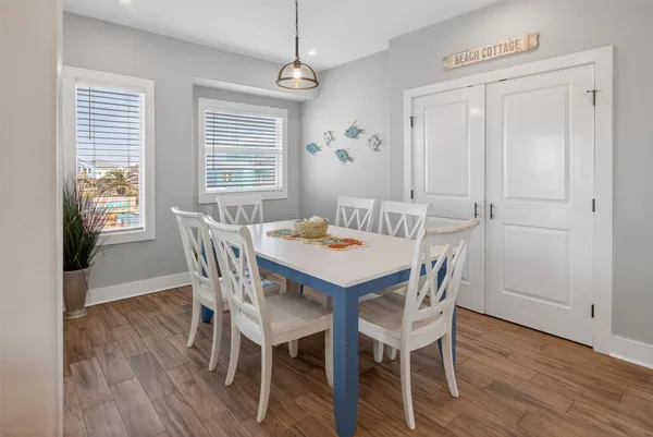a dining room with furniture window wooden floor