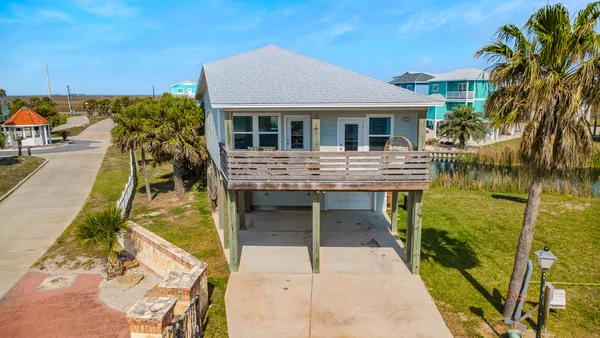 a balcony with table and chairs