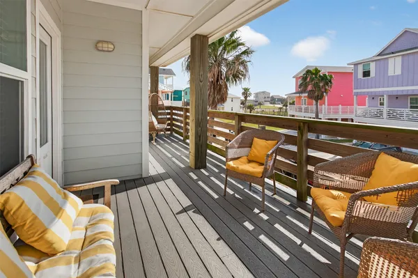 a view of a balcony with wooden floor