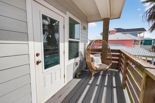 a kitchen with stainless steel appliances wooden floor dining table and chairs