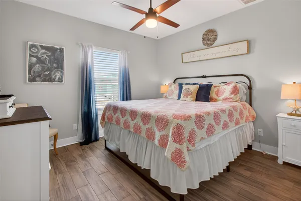 a bedroom with a bed and a table in it