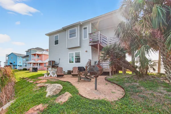 a view of a lake with couches and city view