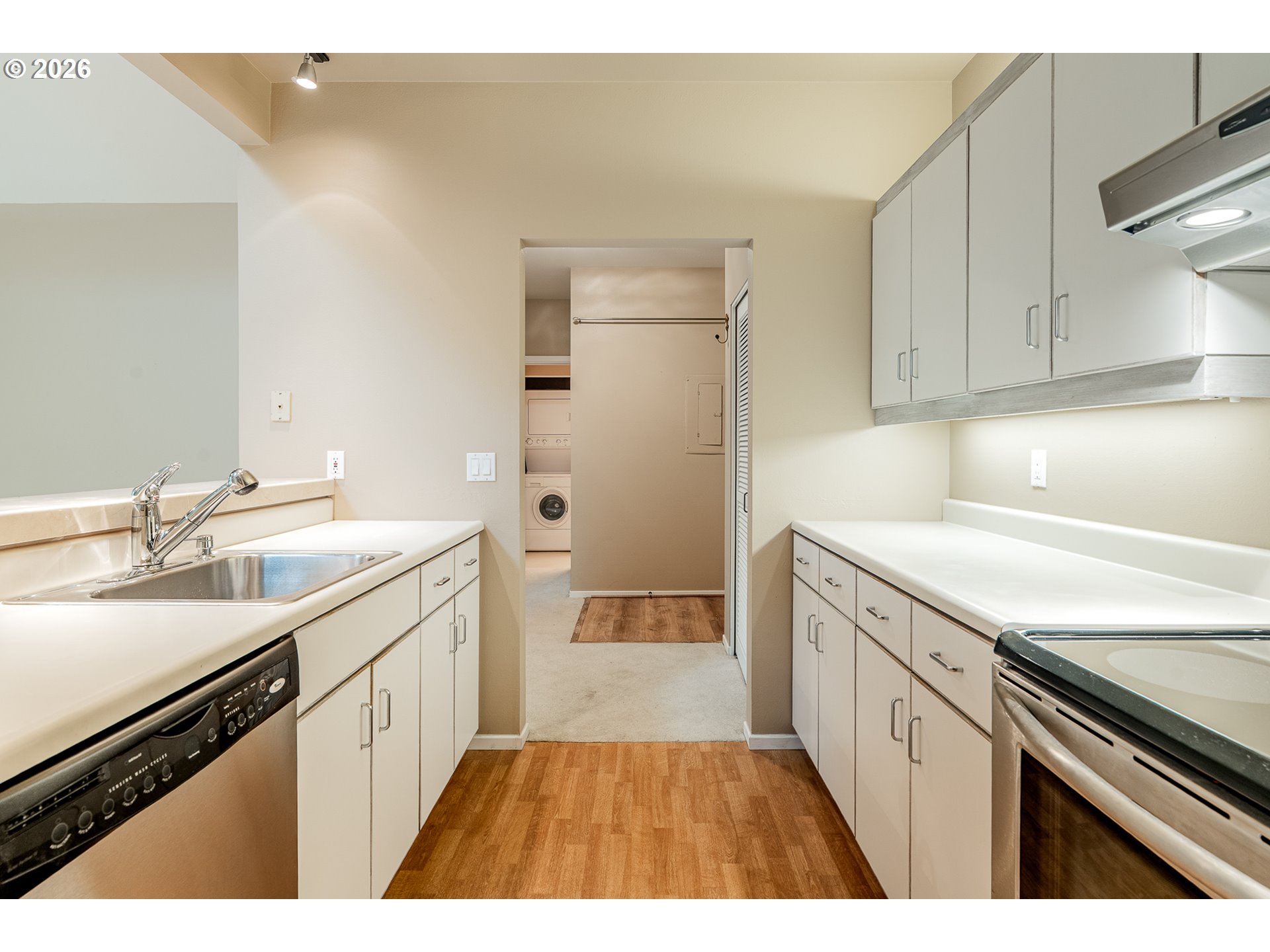 205 South Montgomery Street, Unit 401B Portland, OR 97201 - Photo 13 of 33 a kitchen with a sink stove and cabinets