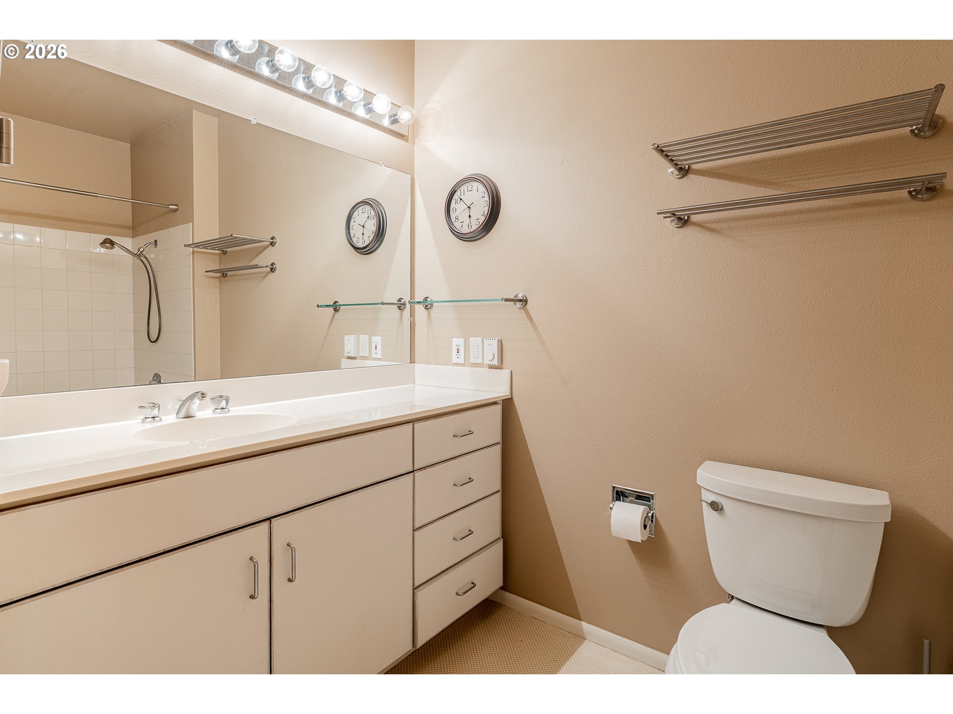 205 South Montgomery Street, Unit 401B Portland, OR 97201 - Photo 22 of 33 a bathroom with a toilet sink and mirror