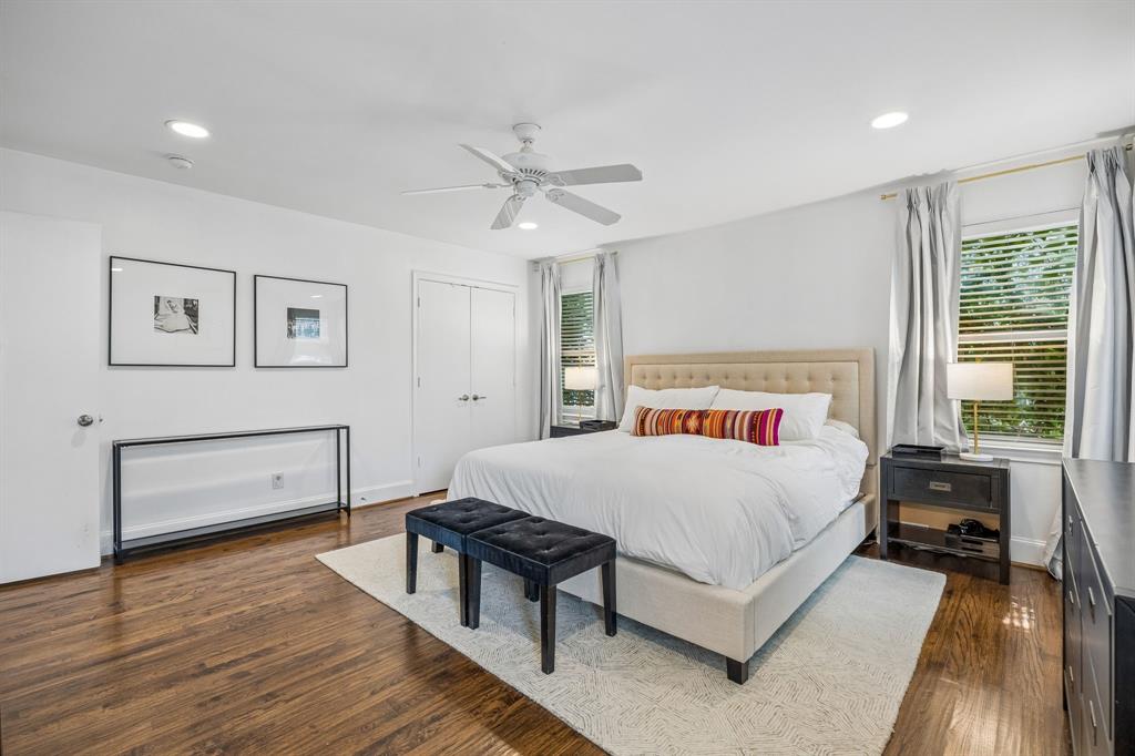 5130 Rexton Lane Dallas, TX 75214 - Photo 19 of 28 a bedroom with a bed and a workspace