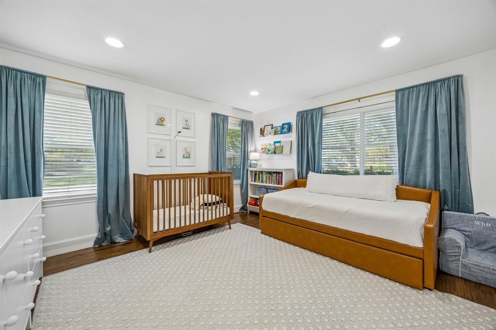 5130 Rexton Lane Dallas, TX 75214 - Photo 21 of 28 a bedroom with a bed and a window