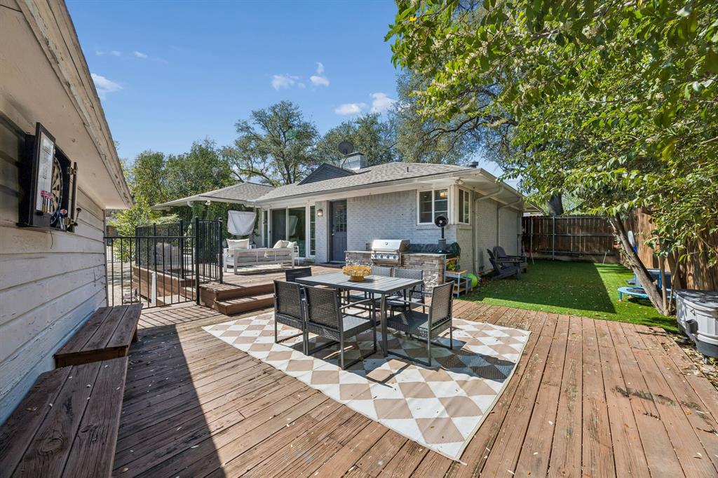 5130 Rexton Lane Dallas, TX 75214 - Photo 23 of 28 a view of a patio with table and chairs wooden floor and fence