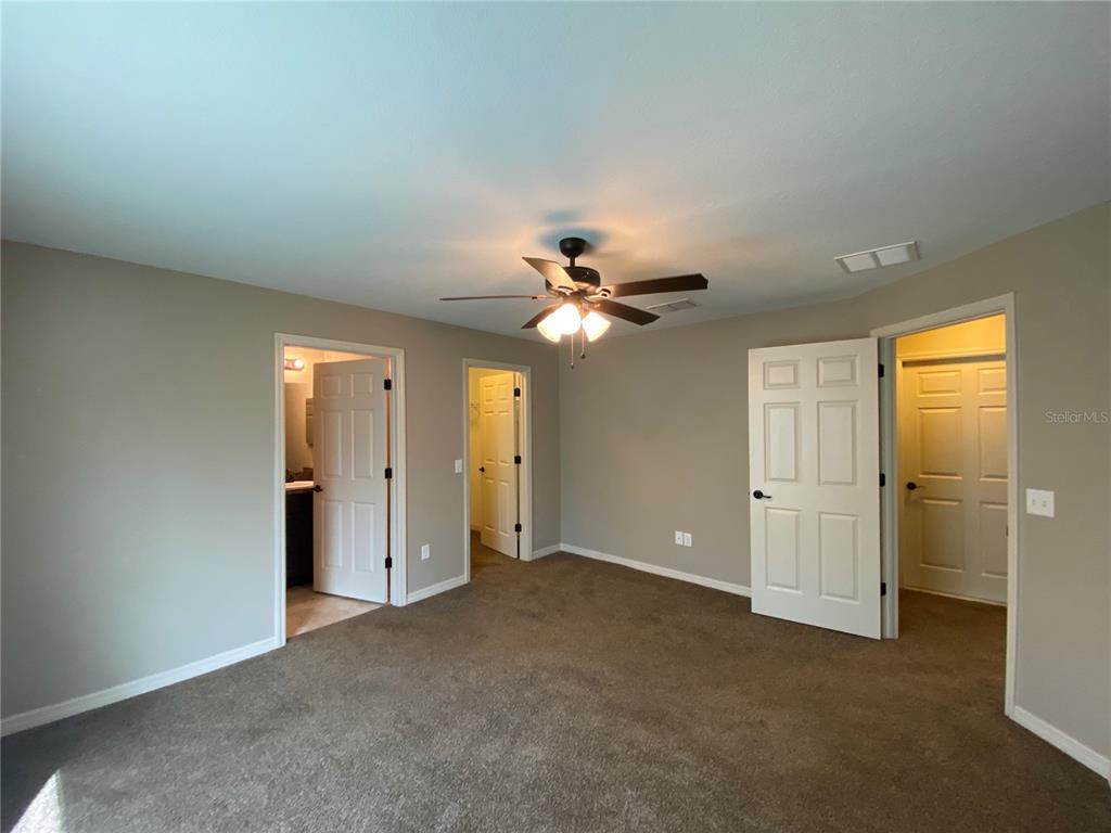 2559 Southwest 159th Lane Ocala, FL 34473 - Photo 13 of 22 an empty room with closet and a ceiling fan