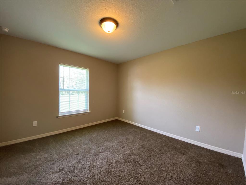2559 Southwest 159th Lane Ocala, FL 34473 - Photo 17 of 22 an empty room with a window