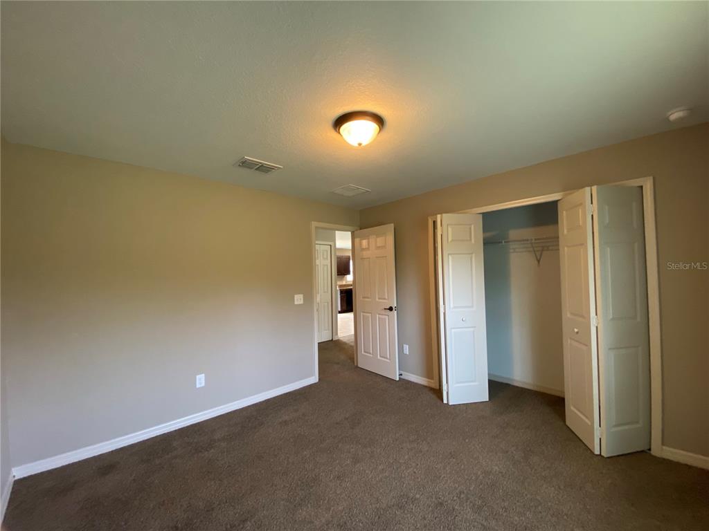 2559 Southwest 159th Lane Ocala, FL 34473 - Photo 18 of 22 an empty room with closet area and mirrors