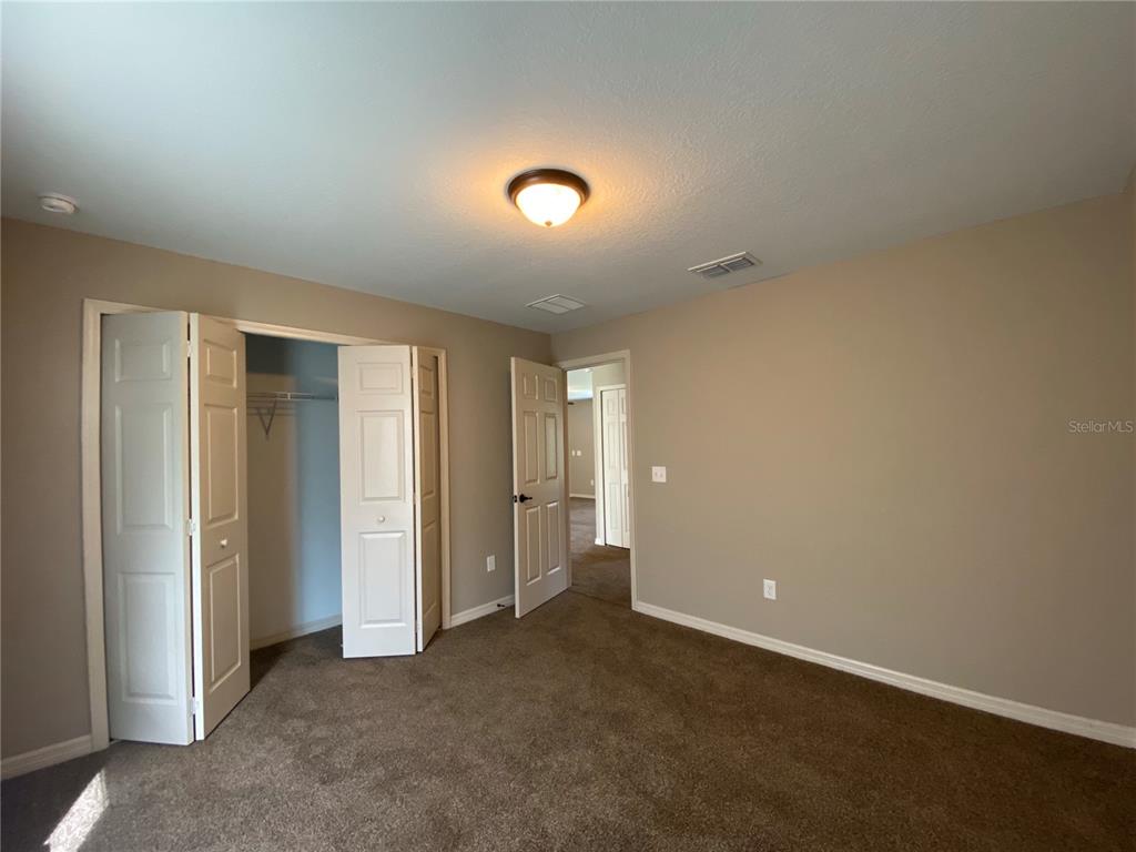 2559 Southwest 159th Lane Ocala, FL 34473 - Photo 20 of 22 an empty room with closet area and bathroom