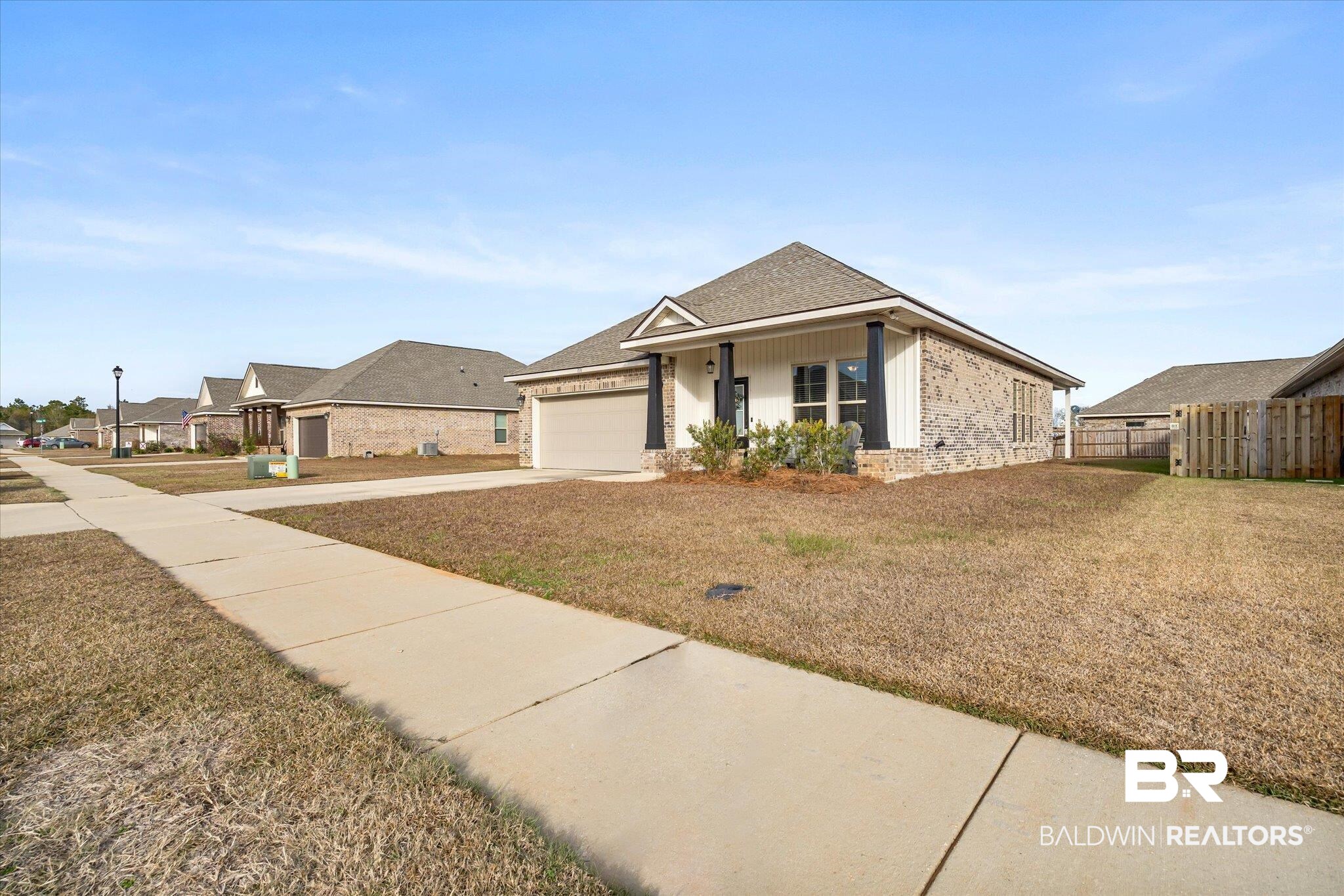 1116 Stella Road Foley, AL 36535 - Photo 28 of 29 View of front facade featuring a garage and a front lawn