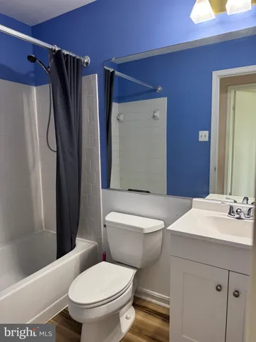 a white toilet sitting next to a bathroom sink