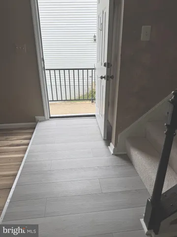 a kitchen with stainless steel appliances a refrigerator and a stove top oven
