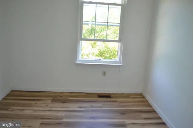 a view of a room that has a window in it