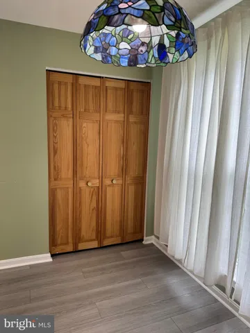 a view of an entryway with wooden floor
