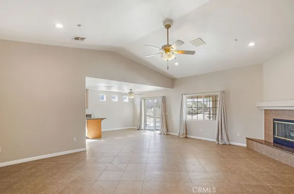 a view of an empty room and a fireplace