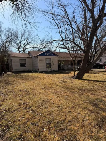 a view of a house with a snow in front of yard