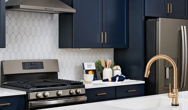 a kitchen with stainless steel appliances granite countertop a stove top oven a refrigerator a sink and a dining table with wooden floor