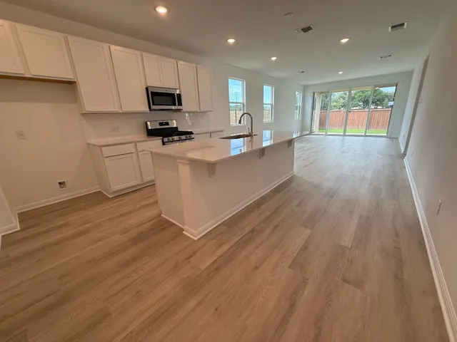 a bathroom with a sink a mirror and shower